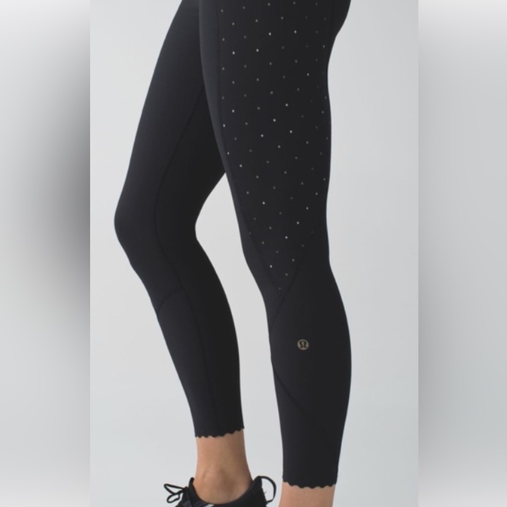 Lululemon Tight Stuff Tight.  Size 4.  Reflective with Scalloped hem.